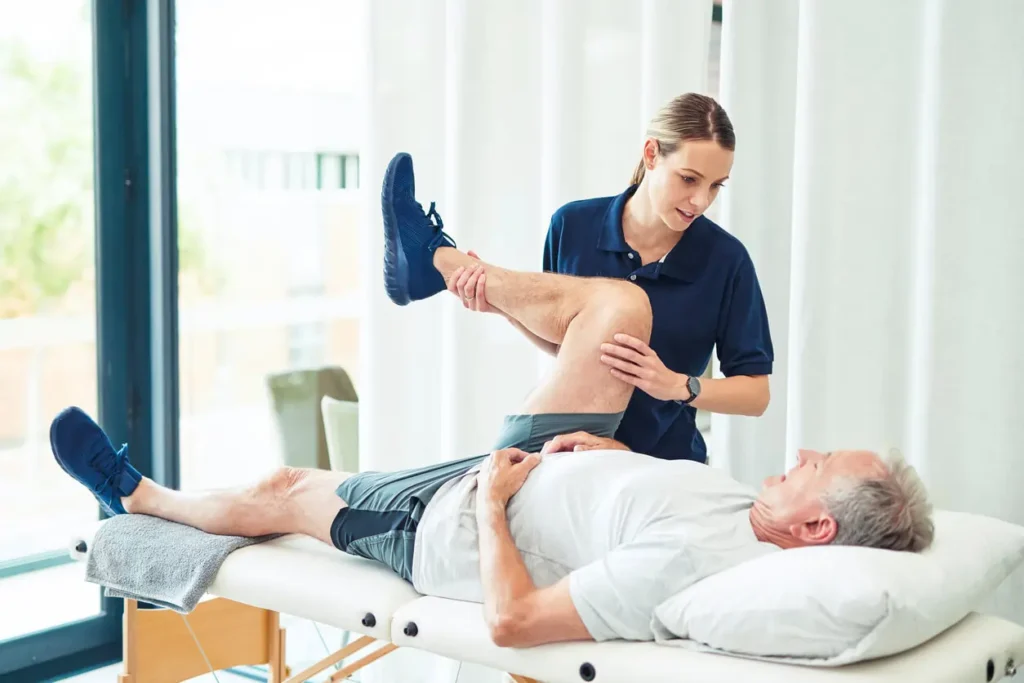 Revitalising Recovery: Effective Rehabilitation Strategies for Muscle Injuries 3 Physiotherapist assisting a patient with muscle recovery exercises Buckingham