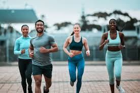 Sculpting Sleek Arms: The Essential Role of Cardio in Toning Without Bulking Up 3 image of people running to incorporate cardio Buckingham exercise into their life to help tone arms and body.